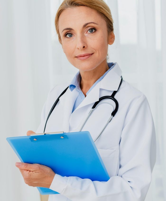 doctor-holding-clipboard-looking-camera (1)
