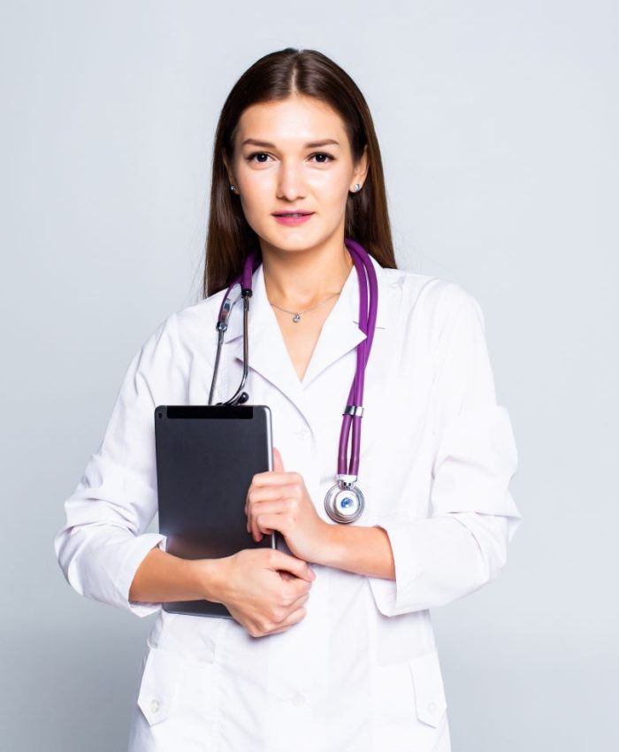 doctor-using-tablet-computer-isolated-white-wall