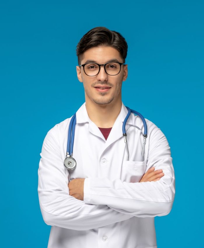 doctors-day-handsome-brunette-cute-guy-medical-gown-with-crossed-hands