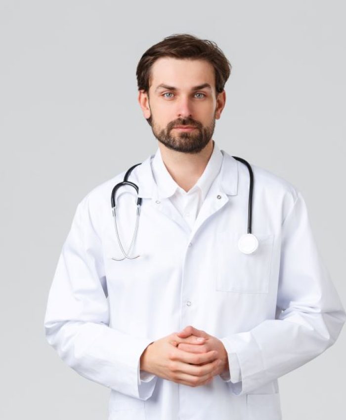 hospital-healthcare-workers-covid-19-treatment-concept-young-doctor-scrubs-making-daily-errands-clinic-listening-patient-symptoms-look-camera-professional-physician-curing-diseases