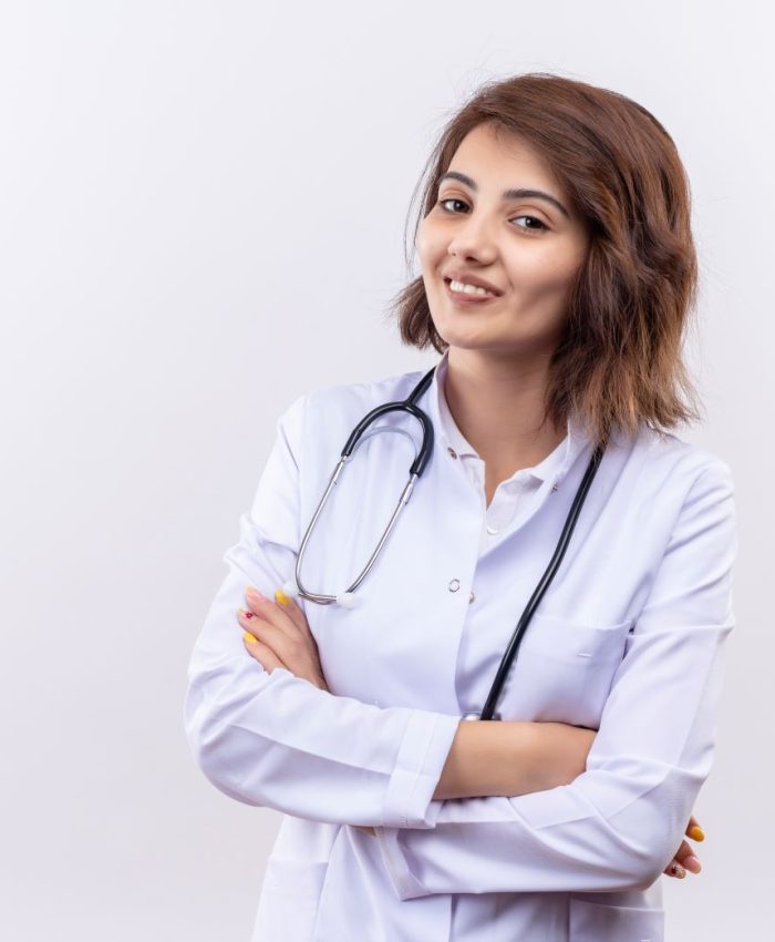 young-woman-doctor-white-coat-with-stethoscope-smiling-confident-standing-with-arms-crossed-white-wall